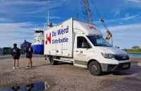 de bus van De Werd distibutie bij de roeiwedstrijden